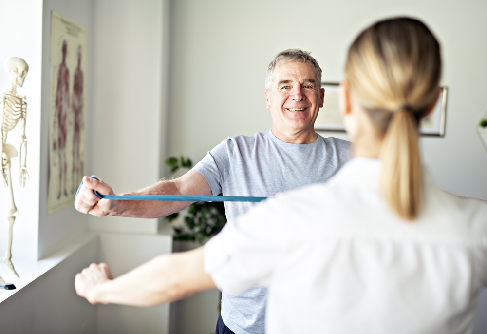 Physiotherapist working with a senior patient in the clinic
