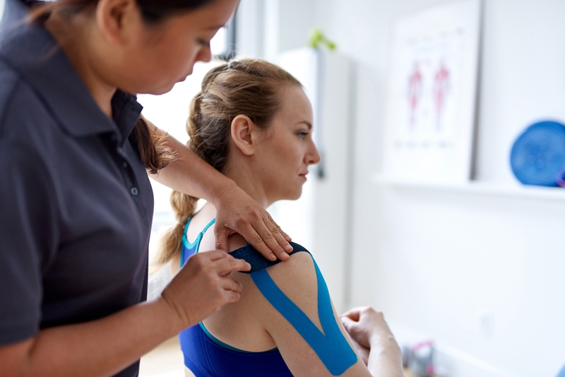 Physiotherapist treating a patient's shoulder